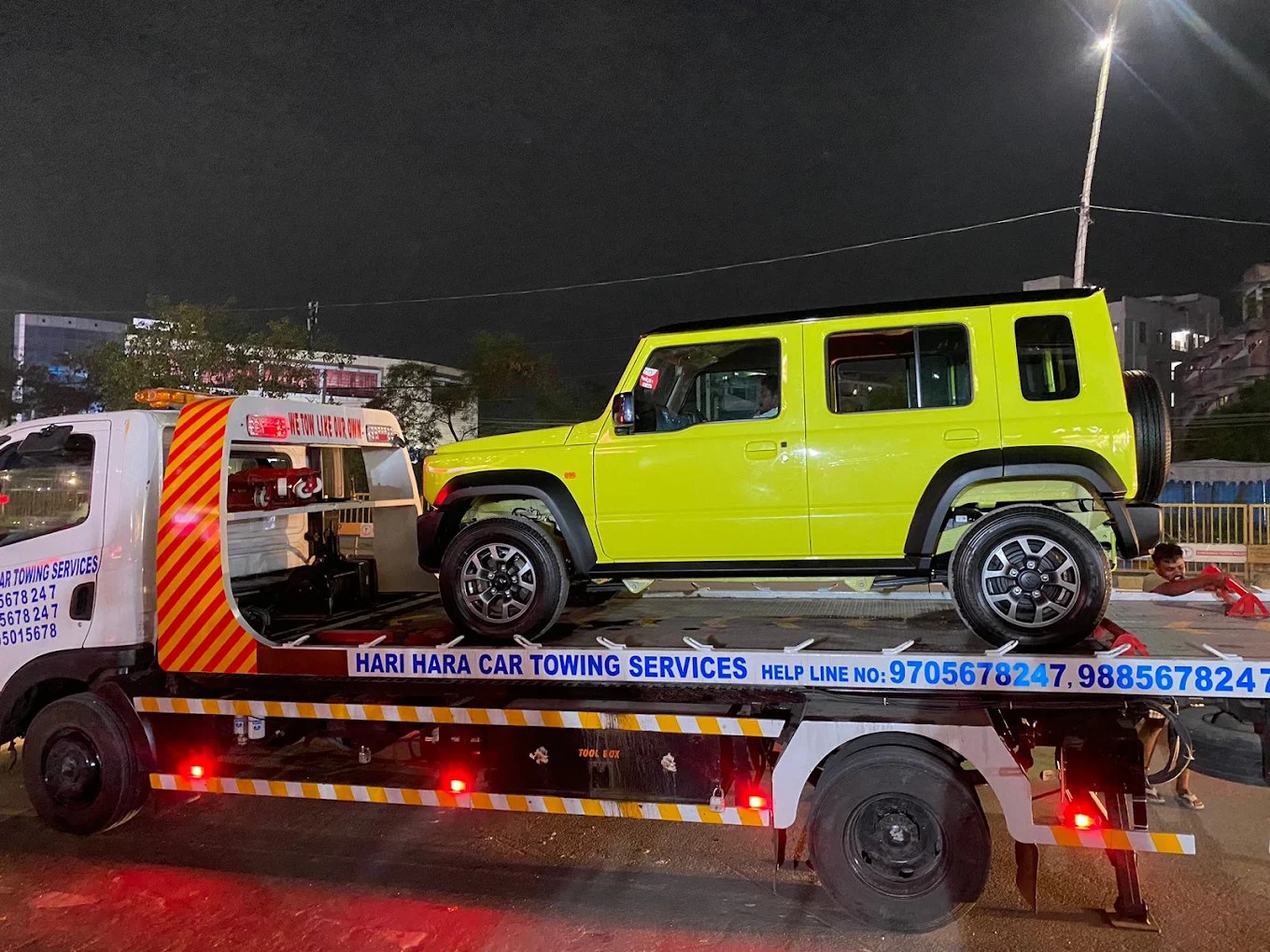 SUV loaded on a flatbed tow truck